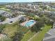 Community pool with surrounding landscaping at 2020 Estancia Cir # A, Kissimmee, FL 34741