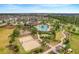 Aerial view of community amenities including pool, playground, and sports courts at 488 Kistler Cir, Clermont, FL 34715