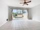 Bright living room with view of private pool and patio at 2338 Silver Palm Dr, Kissimmee, FL 34747