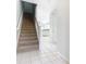 Carpeted staircase leading to the upper level of the townhome at 2338 Silver Palm Dr, Kissimmee, FL 34747