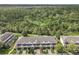 Aerial view of townhouses near a wooded area at 2338 Silver Palm Dr, Kissimmee, FL 34747