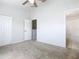 Bedroom with carpet, double doors to closet, and bathroom access at 2338 Silver Palm Dr, Kissimmee, FL 34747