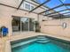 Private backyard oasis with a refreshing pool at 2338 Silver Palm Dr, Kissimmee, FL 34747