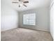 Bright bedroom with neutral carpeting and window blinds at 2338 Silver Palm Dr, Kissimmee, FL 34747