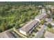 Aerial view of townhouses with a wooded backdrop at 2338 Silver Palm Dr, Kissimmee, FL 34747