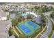 Aerial view showing community amenities including tennis courts, pool, and playground at 2338 Silver Palm Dr, Kissimmee, FL 34747