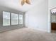 Bright bedroom with neutral walls, carpet flooring, and multiple windows at 2338 Silver Palm Dr, Kissimmee, FL 34747