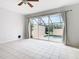 Living room features sliding doors to screened patio and pool at 2338 Silver Palm Dr, Kissimmee, FL 34747