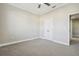 Spacious bedroom with carpeted floor and double doors at 2960 Bella Vista Dr, Davenport, FL 33897