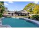 Inviting kidney-shaped swimming pool in a lush backyard setting at 3417 Pershing Ave, Orlando, FL 32812