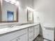 Double vanity bathroom with white cabinets and marble countertops at 693 Charrice Pl, Sanford, FL 32771