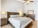 Spacious bedroom with wooden bed frame, light bedding, and ample floor space at 693 Charrice Pl, Sanford, FL 32771