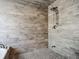 Large walk-in shower with wood-look tile and a rainfall shower head at 693 Charrice Pl, Sanford, FL 32771