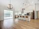 Modern kitchen with white cabinets, stainless steel appliances, and island at 693 Charrice Pl, Sanford, FL 32771