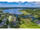 Stunning aerial view of lakefront homes and lush landscape at 693 Charrice Pl, Sanford, FL 32771