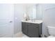 Clean bathroom with gray vanity and white toilet at 7740 Sandy Ridge Dr # 218, Reunion, FL 34747