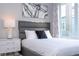 Bright bedroom with a comfortable bed and large window at 7740 Sandy Ridge Dr # 218, Reunion, FL 34747