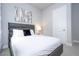Well lit bedroom with a comfortable bed at 7740 Sandy Ridge Dr # 218, Reunion, FL 34747