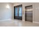 Building lobby with elevator and exit access at 7740 Sandy Ridge Dr # 218, Reunion, FL 34747