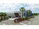 Modern community building with ample parking at 7740 Sandy Ridge Dr # 218, Reunion, FL 34747