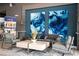 Lobby with comfortable seating and large blue artwork at 7740 Sandy Ridge Dr # 218, Reunion, FL 34747