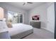 Comfortable bedroom with a large TV and plenty of light at 7740 Sandy Ridge Dr # 218, Reunion, FL 34747