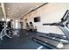 Modern gym with treadmills and stationary bikes at 7740 Sandy Ridge Dr # 218, Reunion, FL 34747