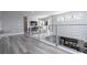 Open upper floor with modern railing overlooking the lower floor at 7740 Sandy Ridge Dr # 218, Reunion, FL 34747