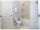 Clean bathroom with a bathtub and shower at 7740 Sandy Ridge Dr # 218, Reunion, FL 34747