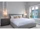 Bright bedroom with large window and comfortable bed at 7740 Sandy Ridge Dr # 218, Reunion, FL 34747