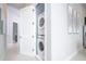 Convenient laundry closet with washer and dryer in hallway at 7740 Sandy Ridge Dr # 218, Reunion, FL 34747