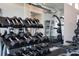 Rack of dumbbells in a well-lit gym at 7740 Sandy Ridge Dr # 218, Reunion, FL 34747