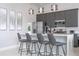 Modern kitchen with stainless steel appliances and breakfast bar at 7740 Sandy Ridge Dr # 218, Reunion, FL 34747