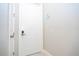 Modern entryway with white door and keyless entry at 7740 Sandy Ridge Dr # 218, Reunion, FL 34747