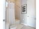 Clean bathroom with a bathtub and shower at 7740 Sandy Ridge Dr # 218, Reunion, FL 34747
