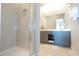 Modern bathroom with a walk-in shower and double vanity at 7740 Sandy Ridge Dr # 218, Reunion, FL 34747