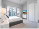 Bright bedroom with large window and comfortable bed at 7740 Sandy Ridge Dr # 218, Reunion, FL 34747