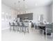 Modern kitchen with stainless steel appliances and breakfast bar at 7740 Sandy Ridge Dr # 218, Reunion, FL 34747