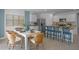 Modern kitchen with island, breakfast bar, and dining area at 4145 Singing Mockingbird Blvd, Bartow, FL 33830
