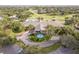 Community clubhouse with fountain and circular driveway at 38748 Lakeview Walk, Lady Lake, FL 32159
