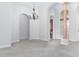 Elegant dining room with high ceilings and a chandelier at 38748 Lakeview Walk, Lady Lake, FL 32159