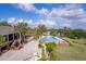 Relaxing pool area with adjacent clubhouse at 38748 Lakeview Walk, Lady Lake, FL 32159