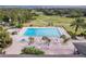 Resort-style pool with ample lounge chairs and tables at 38748 Lakeview Walk, Lady Lake, FL 32159