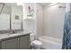 Clean bathroom with granite countertop and shower/tub combo at 6546 Quest St, Saint Cloud, FL 34771