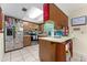 Galley style kitchen with wood cabinetry at 932 N Fairbairn Dr, Deltona, FL 32725