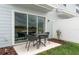 Private patio with seating area and sliding glass doors at 4511 Cypress Cay Way, Kissimmee, FL 34746