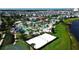 Aerial view showing community amenities including pools, a sand volleyball court, and a basketball court at 3191 Paradox Cir # 406, Kissimmee, FL 34746