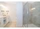 Modern bathroom with double vanity, large shower, and neutral tile at 3191 Paradox Cir # 406, Kissimmee, FL 34746