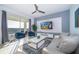 Living room with comfortable seating, large TV and balcony access at 3191 Paradox Cir # 406, Kissimmee, FL 34746