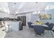 Open concept kitchen and dining area with modern finishes at 3191 Paradox Cir # 406, Kissimmee, FL 34746